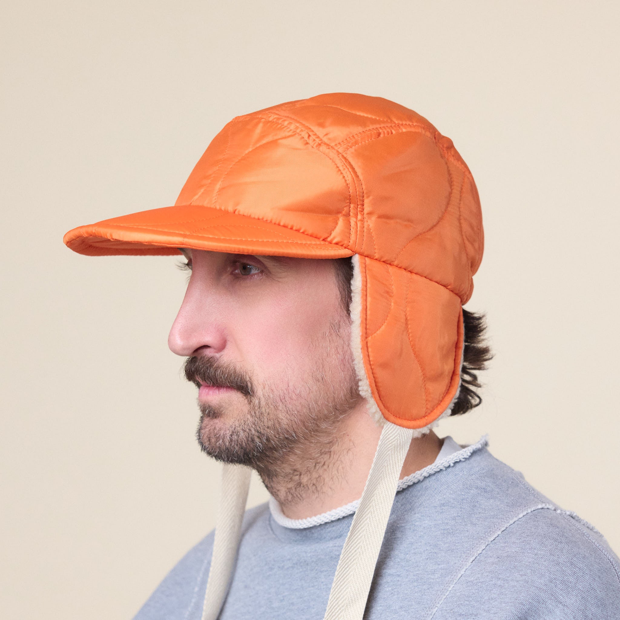 Found Feather - Quilted 1/2 Moon Cap With Ears - Orange