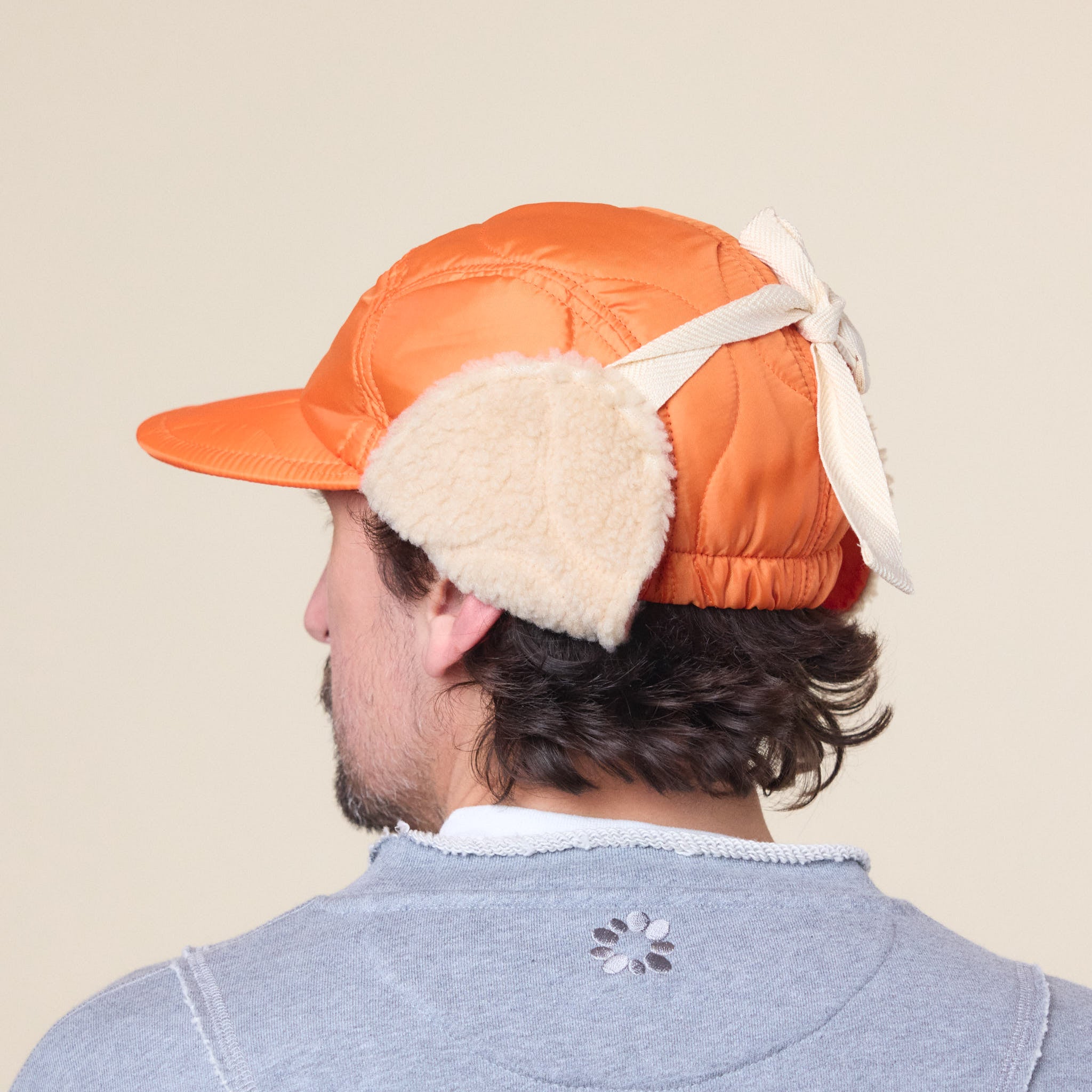 Found Feather - Quilted 1/2 Moon Cap With Ears - Orange